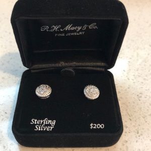 Diamond stud earrings in Sterling Silver.